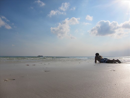 A young man in a natural environment. He might be pondering life.