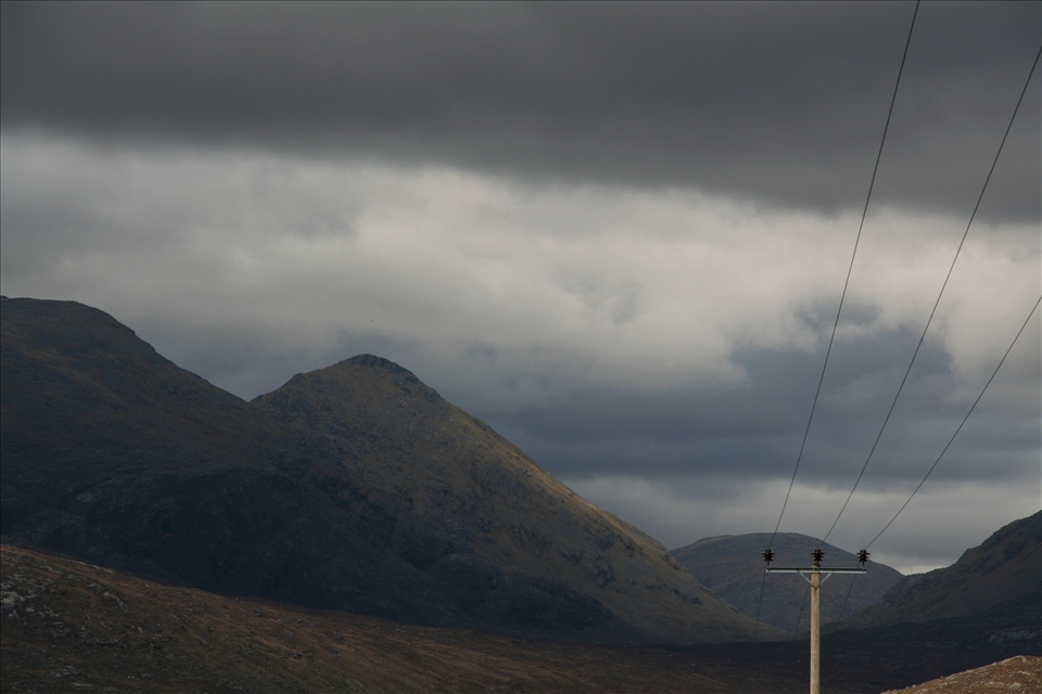 Harris and Lewis, in Scotland, are fascinating places full of contrast. To me, this picture captures the essence of this part of the world - an almost untouched natural beauty, but with the surprising element of modern conveniences. I almost wonder how they put these power lines here as there's hardly any sign of human life for miles.