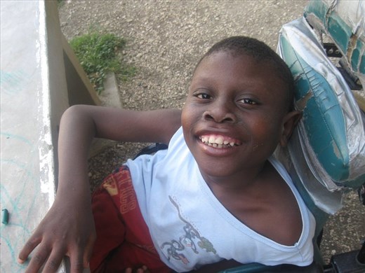 A chaotic Haiti is put at ease by a smile of a child, just for a second.