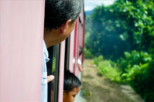Young and old alike peer out the open windows