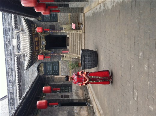 girl in a qipao in the Qiao house