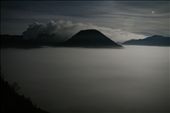 Lit only by moonlight, the view from Cemoro Lawang on the edge of the Tengger Caldera shows the Sea of Sand (Segara Wedi) covered by fog at 4:30am. Mt Bromo can be seen steaming to the left while the majestic Mt Batok is to the right. The early start is to enable us to get to view the sunrise over the Tengger Caldera, a 45 minute trip in a 4-wheel drive down into the caldera, across the Sea of Sand and up Mt Pananjakan on a different side of the caldera to the usual viewing location.: by gmasters, Views[544]