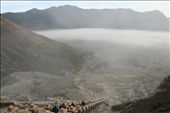 View through the morning mist from the top of the staircase up Mt Bromo to the Hindu temple Pura Luhur Poten on the Sea of Sand beside Mt Batok. Tourists on their morning sunrise tour finish the trip by climbing up from the temple, the smell of sulphur getting stronger as they near the top of the mountain.: by gmasters, Views[629]