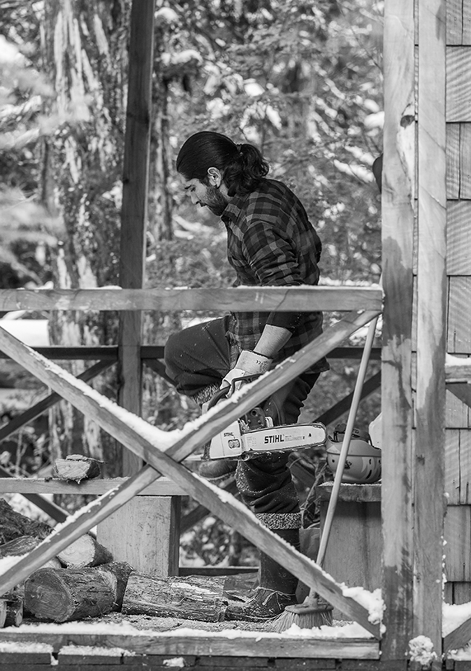 Chopping wood is a must for people who lives in the Patagonia, especially in winter. This guy is using an electric saw, to chop the wood that will keep him and his family warm in the snowy winter.