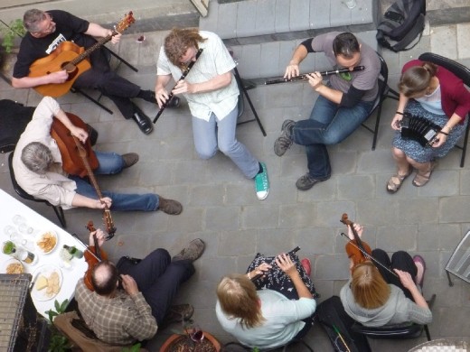 Musicians having a funk session outdoors.