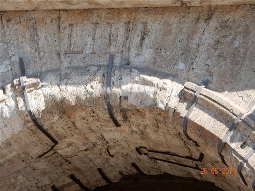 Note bronze holding the stones. Much of this was removed in recent centuries, which caused large portions of the coliseum to tumble during earthquakes. Also note the numerals, which were the assigned  entry gate for those attending events.  The coliseum could be filled in 12 minutes, supposedly