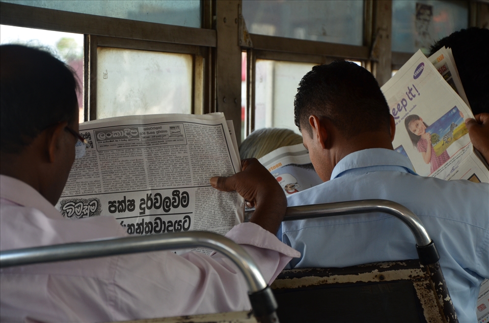 In the morning bus - Newspaper readers 
