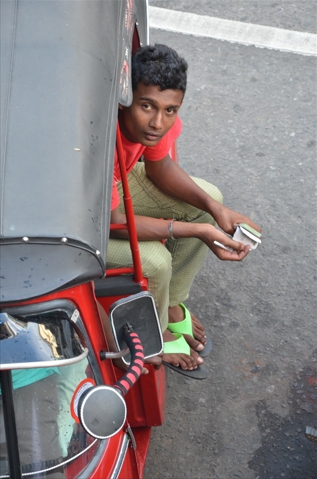 In tuk-tuk - Driver is waiting  for his next destination