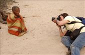An European photographer taking a picture of an elderly Mosarwa woman (Bushmen) at Central Kalahari Game Reserve in Botswana. This raised questions of is this how the Europeans perceive Africans. : by goddy, Views[1719]