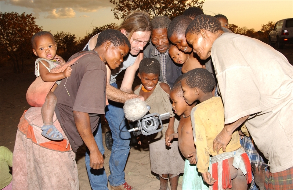 Bushmen or Basarwa as they are affectionately known fascinated by their images in a video camera.