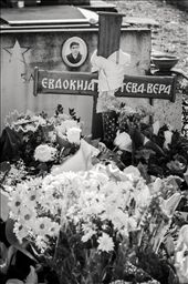 A simple wooden cross marks the grave of Vera Foteva. It is immediately covered in bunches of flowers, representing the respect and admiration people have for her.: by gogofski, Views[1199]