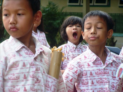 This picture shows a sleepy emotion of a girl as a center of the picture.