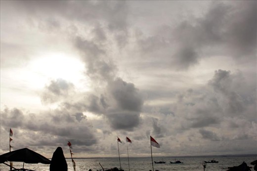 Indonesian Flag waving at seashore.