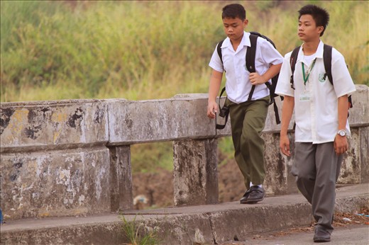 2 brothers/friends as They walk to school. while  conversing Cavite Philippines