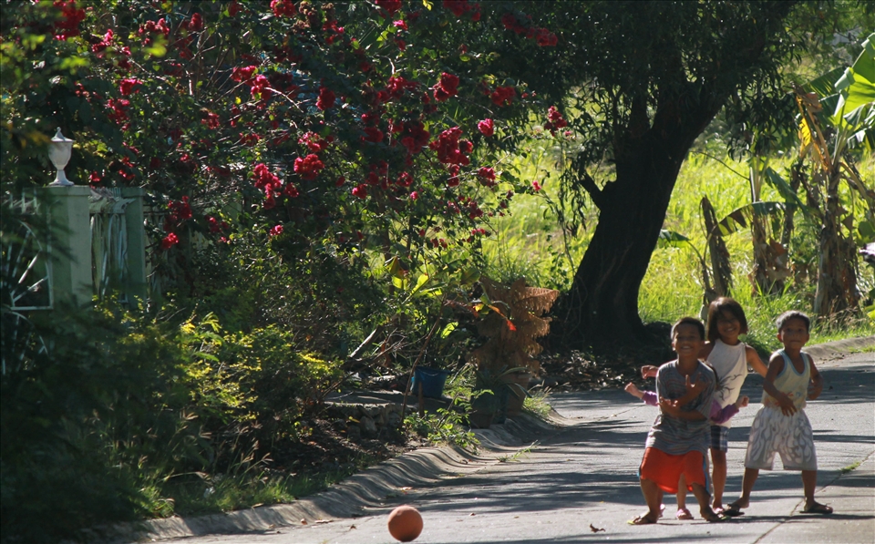 the Children stop playing and suddenly pose when they saw me taking pictures. cavite philippines