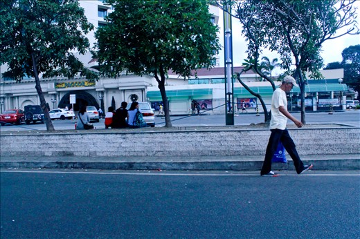 christmas day, as the old man walks alone delivering his presents to his family. Baclaran Paraniaque Philippines