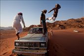 While we were enjoying the spectacular desert sunset, the cheerful and playful Bedouin tour guides drive the jeep up to the top of the Sandune, and jump from the top in a 