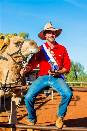 Jockey is all grins after winning the 2014 Uluru Camel Cup.