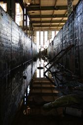 When it rains the old drainage system floods and spent spray paint cans float to the surface. Beautiful reflections and lines of symmetry holds my attention whilst I dismiss every strange sound as “the wind” or “old creaky building noises”. : by graeme, Views[374]