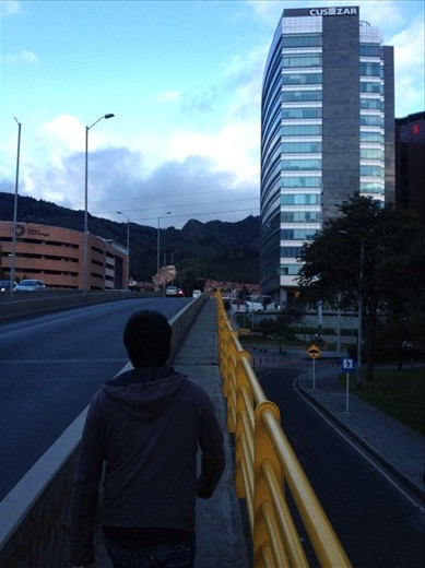 Playing follow the leader yet again, crossing the narrow pedestrian side of a bridge