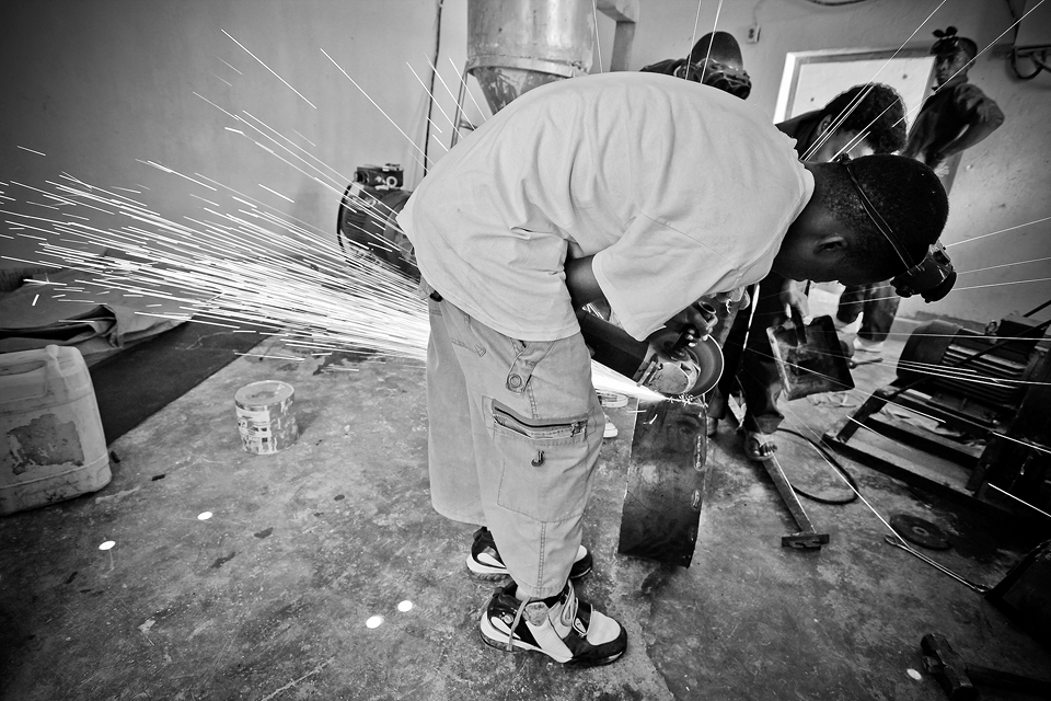 This is one of the teachers. He is a mechanic and teaches the students about the working of different machines. Also how to fix or improve them.