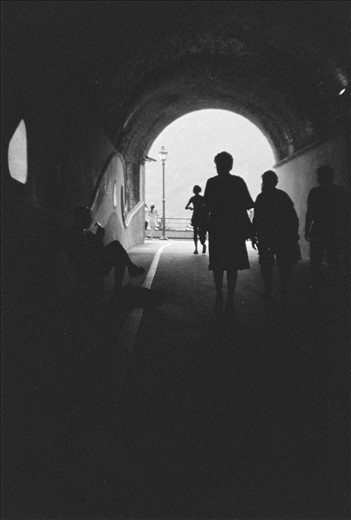 Classical guitarist fills the tunnel with melodies as we walk to a majestic view