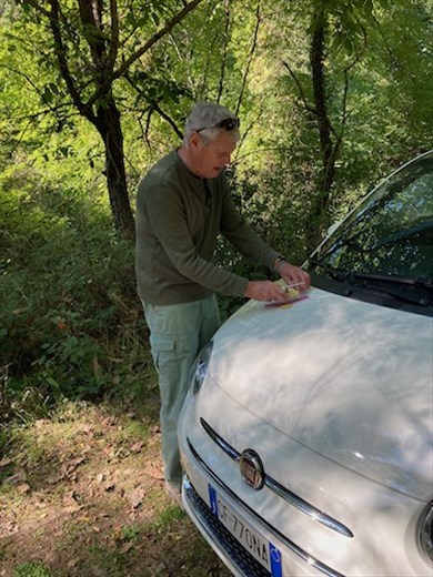 Cutting the cheese for our first picnic of the season, Tuscany