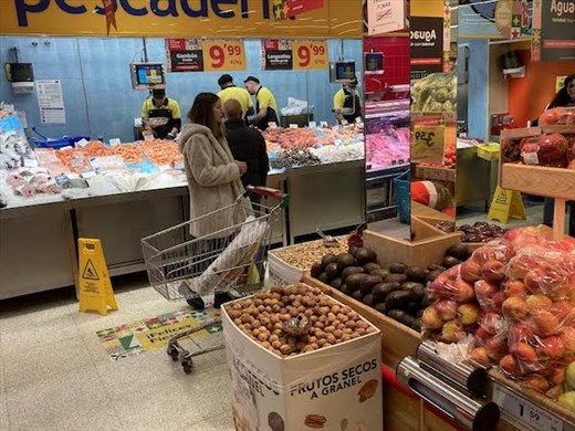 Well-stocked grocery store with butcher and fish-monger