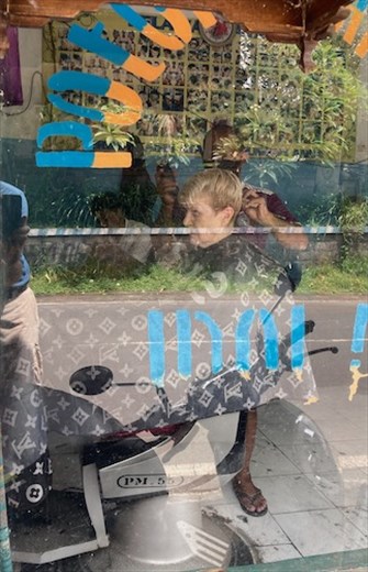 Connie in the barber's chair, Ubud