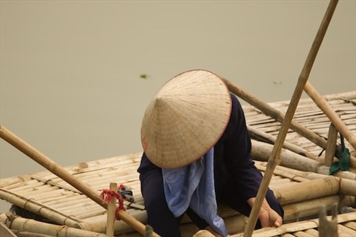Woman in a boat, Van Long Nature Reserve