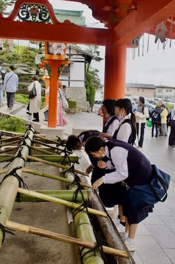 A sip of sacred water for spiritual health, Fushimi Inari Shrine