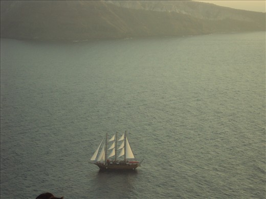 A boat in the sunset of Santorini island,Greece.