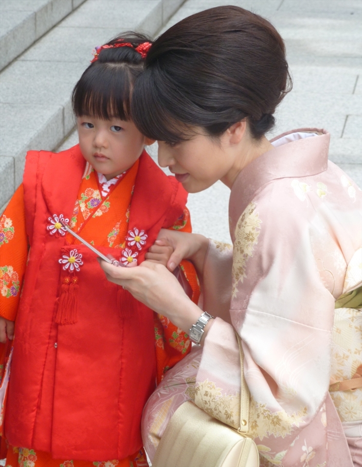 The traditional dress of Japan rubbing shoulders with the most modern of technology
