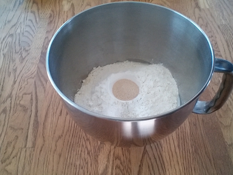 Combining bread ingredients in mixer bowl