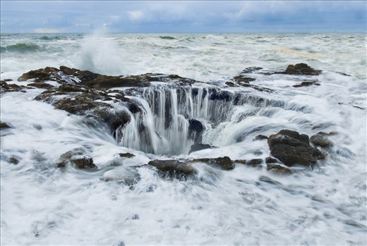 A blowhole takes on water near Cape Perpetua, OR.