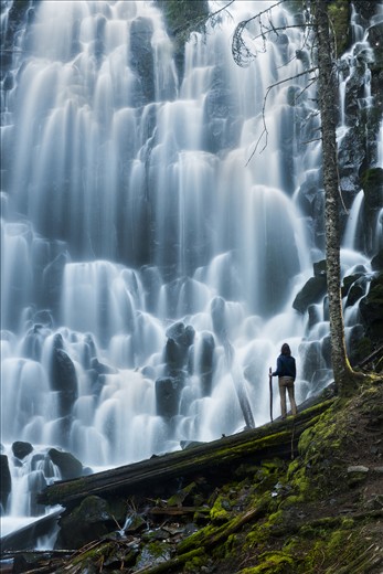 A hiker stands in awe at Ramona Falls, Mt. Hood, OR.