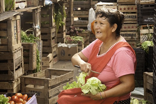 This woman make food looks tasty and it seems it camouflage with the place.