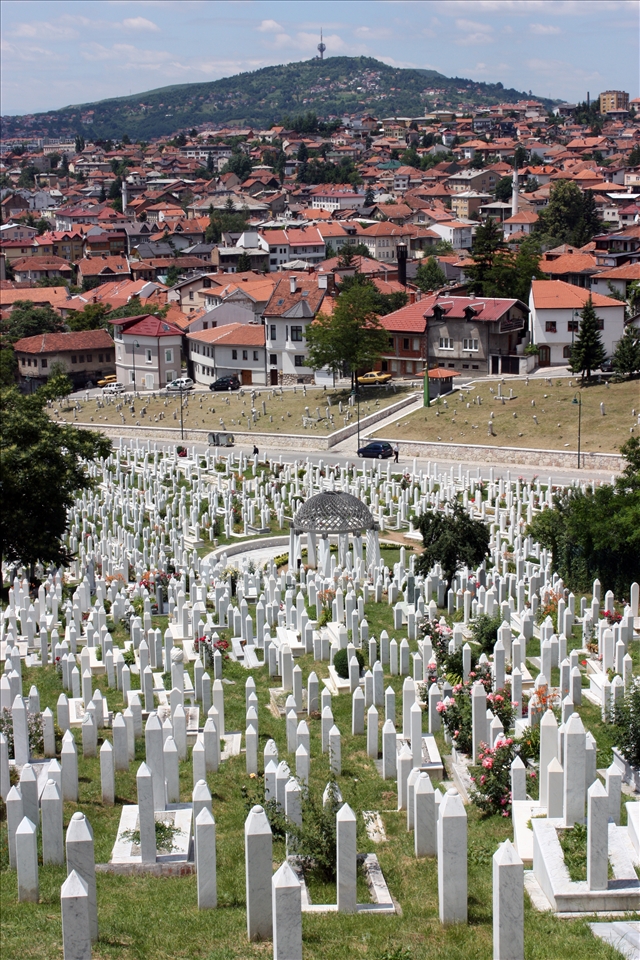 Juxtaposition of the living and the fallen at Alija Izetbegovic cemetary