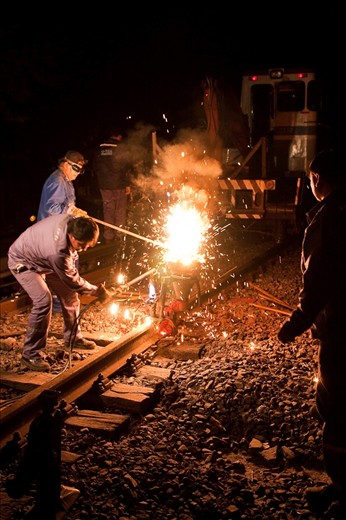 Sparks fly as steel melts in these violent but controlled explosions performed in order to smooth the rails.