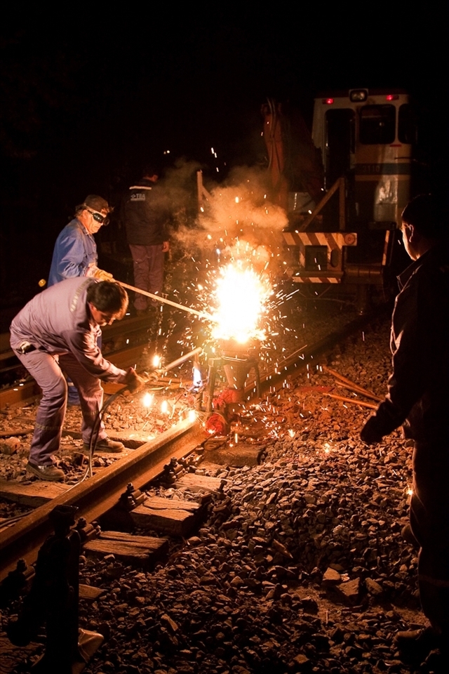 Sparks fly as steel melts in these violent but controlled explosions performed in order to smooth the rails.