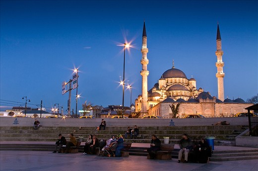 Classic Turkish architecture with the dome and minarets of the mosque imposing on the Istanbul night  .