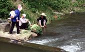 A grandmother carrying her grandchild on the back, chats to two farmer women who are washing the crops in the village river.

The majority of traditional Dong villages are settled along rivers. The water is their centre of life.: by guizhouimpressions, Views[786]