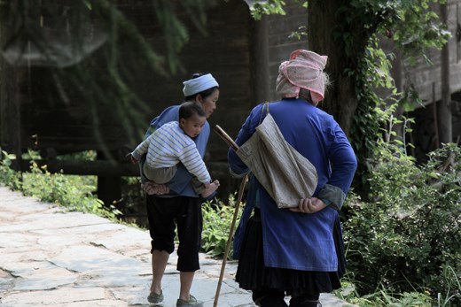 Three generations in Dimen, a Dong-minority village in China's Guizhou Province.

Since the young generation often has to leave their homes for jobs in the city, it's the grandparents who bring up the children.

The Dong people teach children about life by making up songs - something that is also used when trying to impress a love interest.