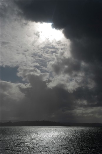 The Tasman Peninsula, Australia, is well known for its beauty and unpredictable weather patterns.  En route from the Hobart to Mum’s farm on the Peninsula the skies opened over one of the many islands.  It seemed as if the Heavens were beckoning us to climb the staircase in the clouds.