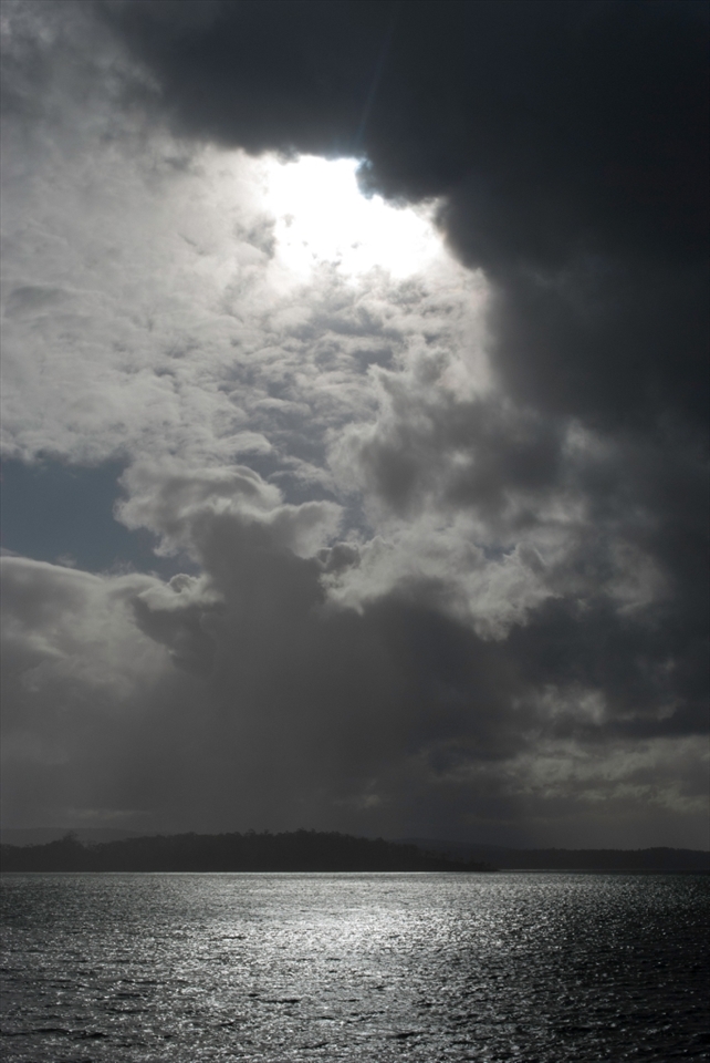 The Tasman Peninsula, Australia, is well known for its beauty and unpredictable weather patterns.  En route from the Hobart to Mum’s farm on the Peninsula the skies opened over one of the many islands.  It seemed as if the Heavens were beckoning us to climb the staircase in the clouds.