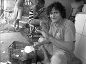 Willy, my home-stay 'brother', a local coconut vender. He collected coconuts from the nearby forest and chilled them in a fridge. He then cut the husk off them and prepared them for drinking. His friends would then come by bike and collect the coconuts to sell around town and make a small profit. As you can see from this photo his garage was the local 'hang-out' spot of the neighborhood. All day people would come and go, without a care in the world!: by gypsy_trotter, Views[509]