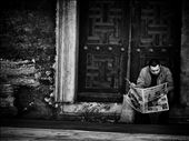 A man casually reads the newspaper at The Blue Mosque: by gypsytraveler, Views[357]