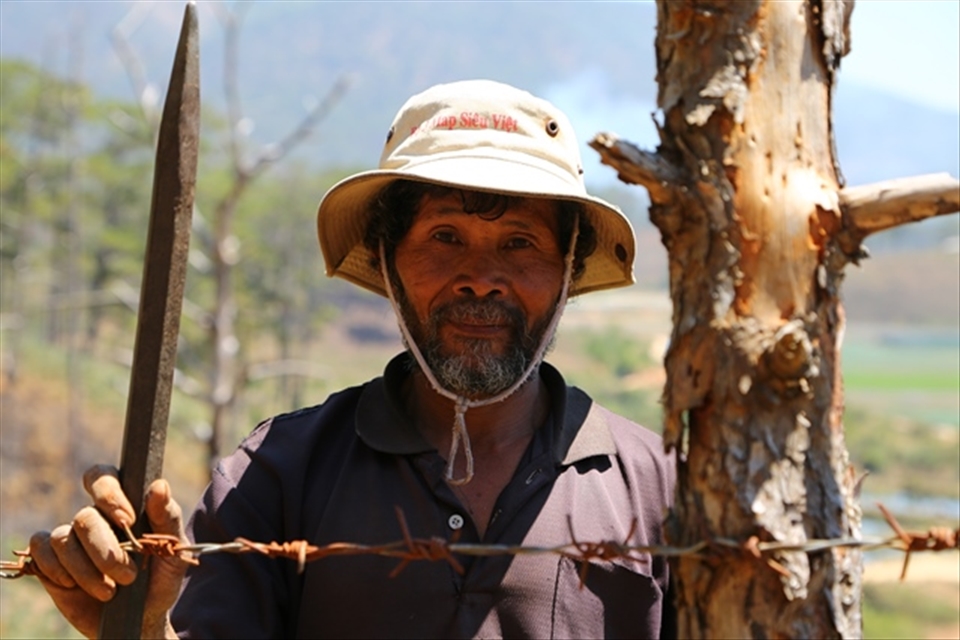 A Co Ho farmer protects his cassava fields in the forests near Biduop Nui Ba national park.