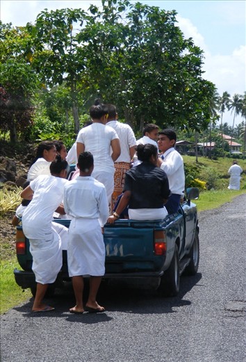 Samoans are a very religious people.  On Sundays they dress in their whitest whites and go to church.  I watched this truck stop by this group of churchgoers and offer them a ride.  I loved how they all piled on to the back, in their whites and smiling all the time.