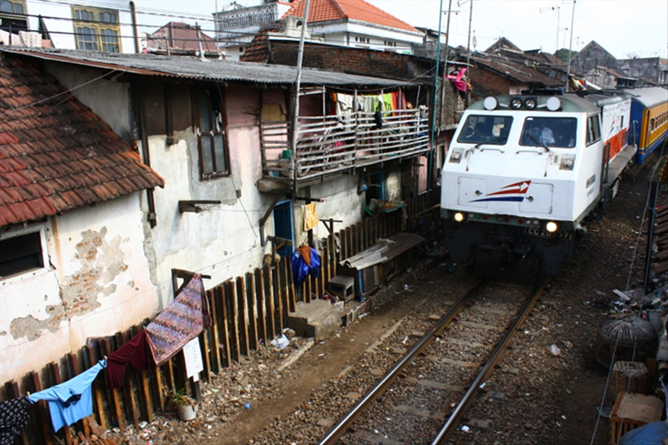 Trains passing in the middle of the old town village in Malang, Indonesia.